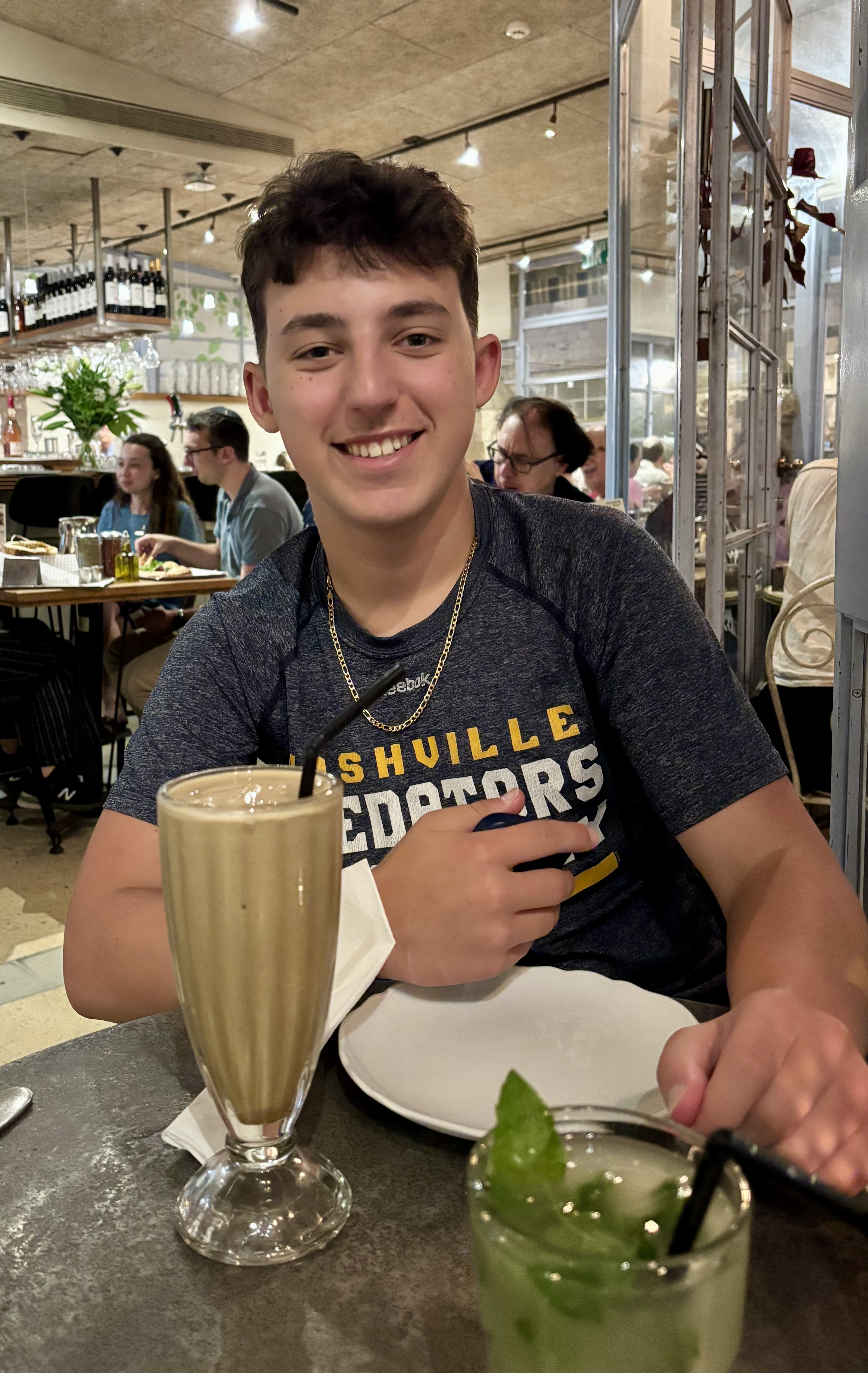 Moshe enjoying his iced cafe at Caffit the night before Mach Hach :)