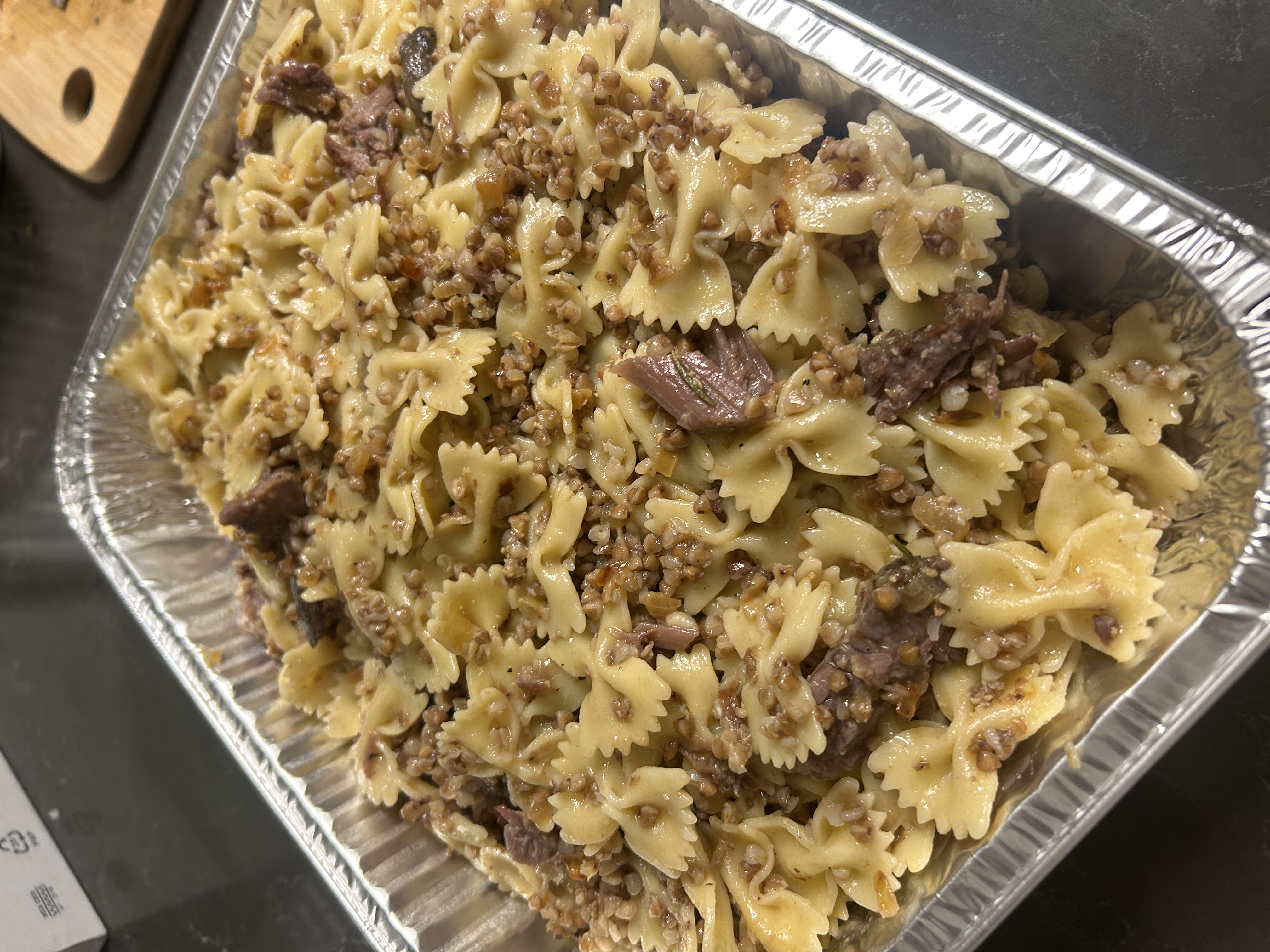 Kasha varnishkes with braised asado ready for Rosh Hashanah lunch at the Dens