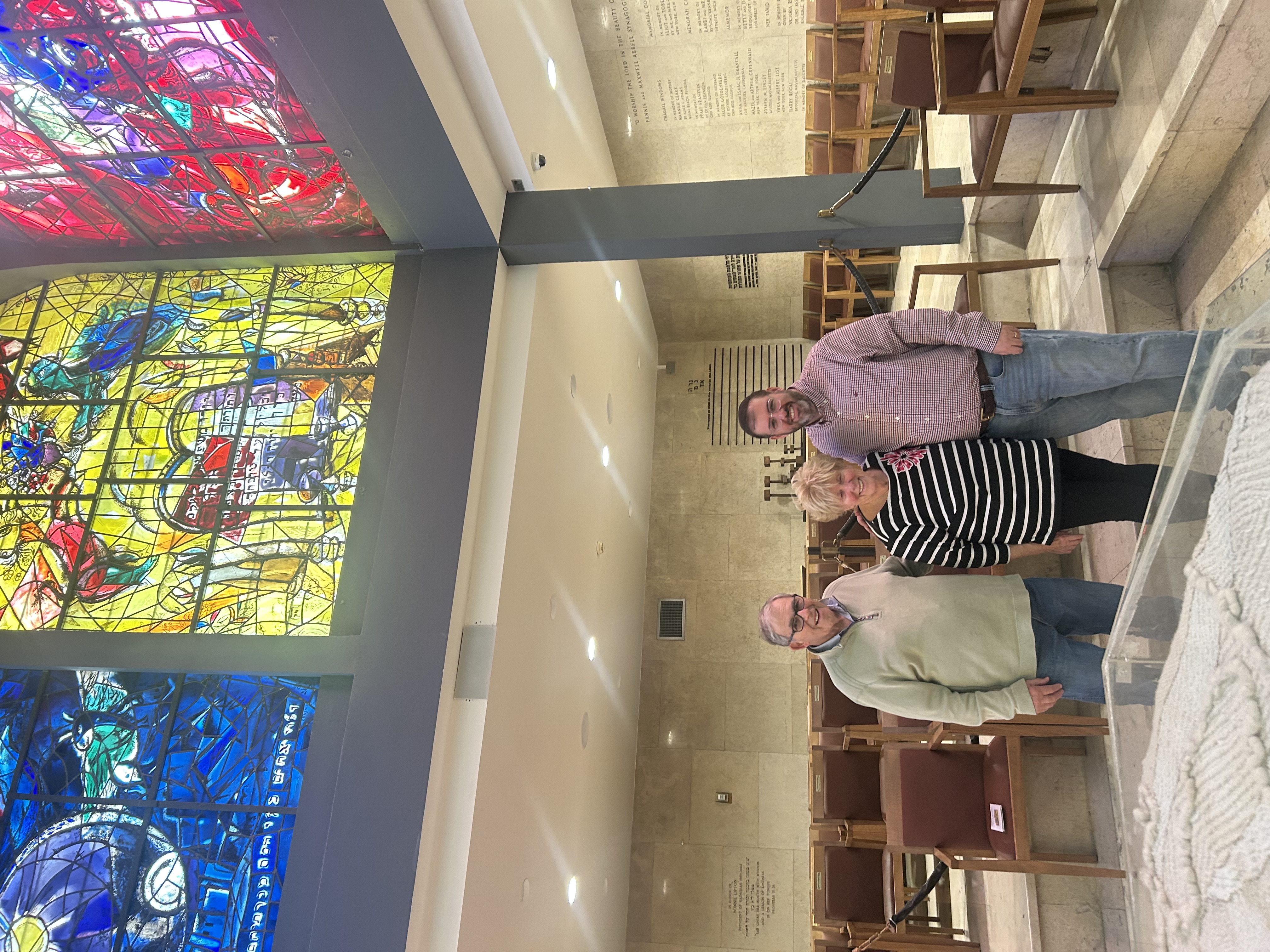 Ted, Karen, and Jonathan beneath the Chagall stained-glass windows