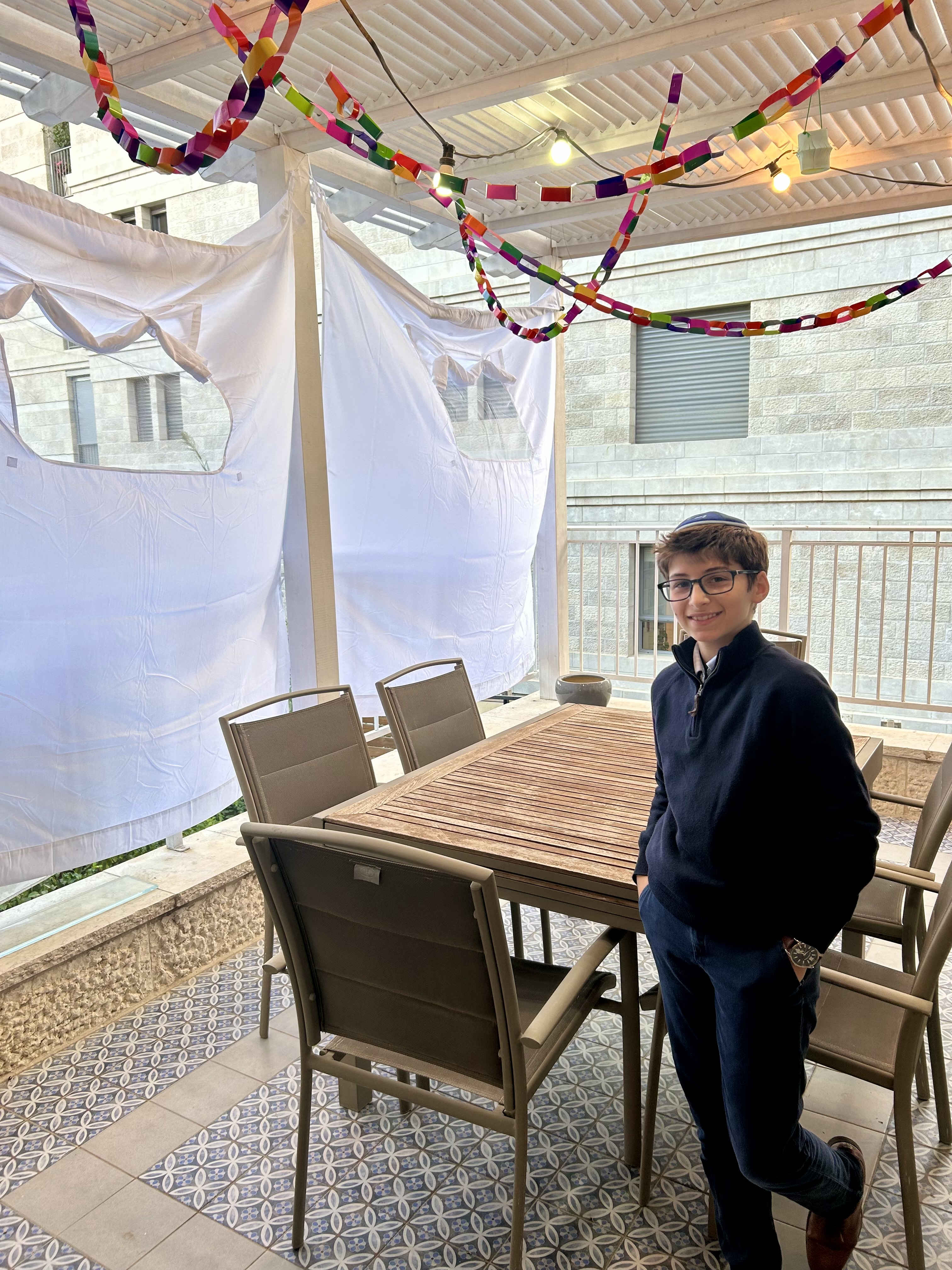 So glad to discover that our apartment’s porch is also a ready-to-use sukkah. Eli dressed and ready for the holiday!