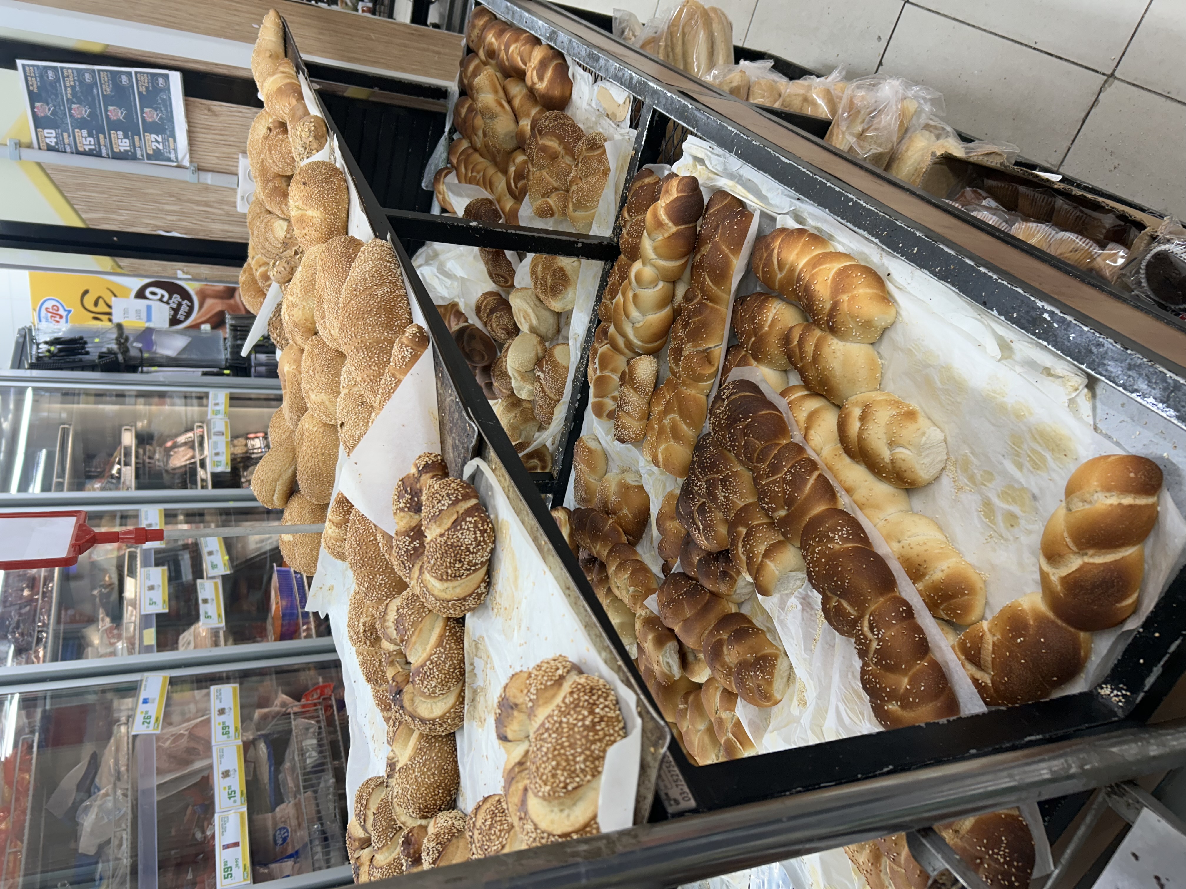 A variety of challahs at the local supermarket. Every shop on the street seems to have fresh challahs and pastries out on Friday mornings, it's hard to choose...