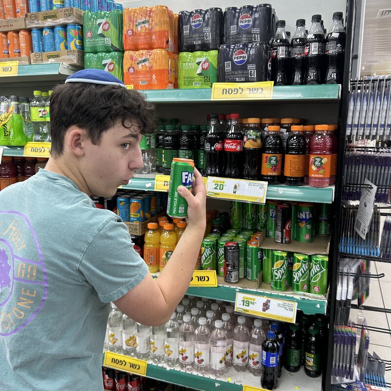 Moshe explores the kosher for Passover soda selection at our neighborhood supermarket