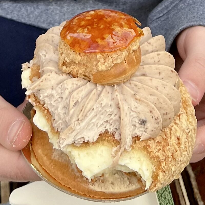 Enjoying a pastry from Kadosh while waiting for our appointment at Misrad Hapnim