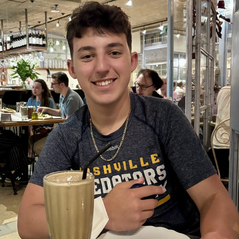 Moshe enjoying his iced cafe at Caffit the night before Mach Hach :)